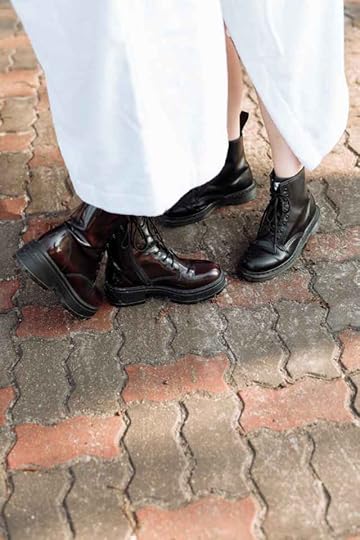 Current image: two people in white bathrobes wearing lace up leather boots