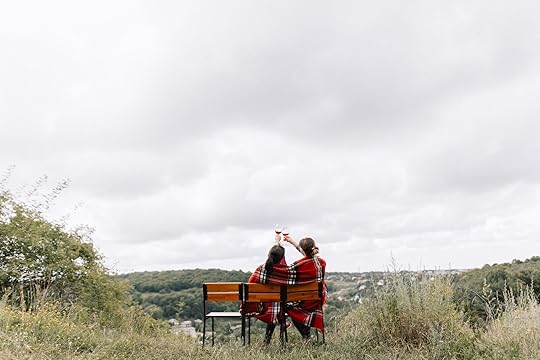 couple drinking wine in mountains