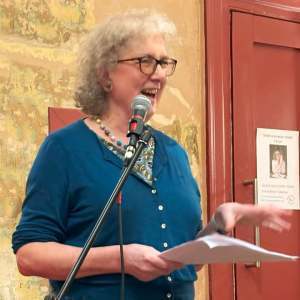 photo of Debbie speaking with microphone