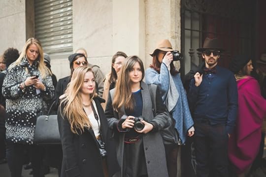 group of people taking photos of influential people