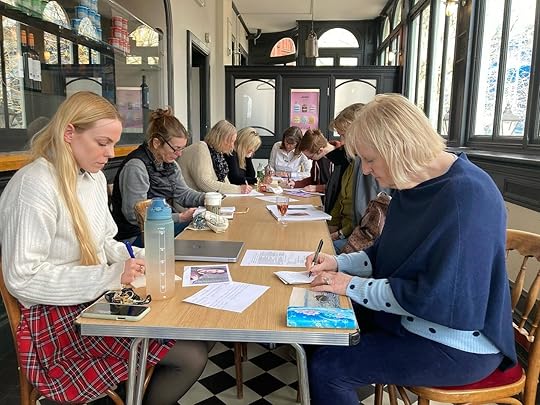 May be an image of 6 people, people studying, table, book and text