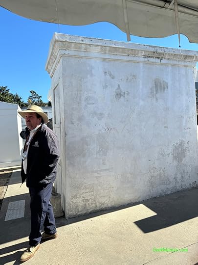 tour guide in front of Marie Laveau tomb