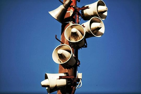 Megaphone Speakers on Wooden Post