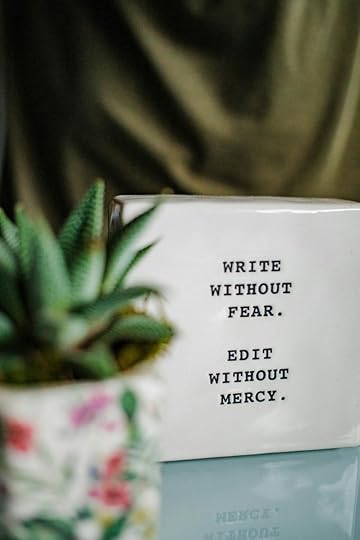 Message on a white block, telling authors to write without fear and edit without mercy.