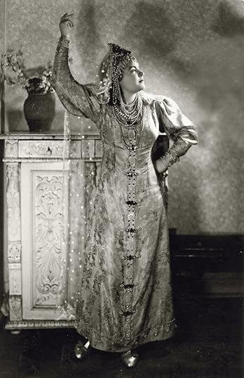 Young Russian woman wearing full court dress of Russian boyarina. Fancy brocade dress and jeweled headdress.