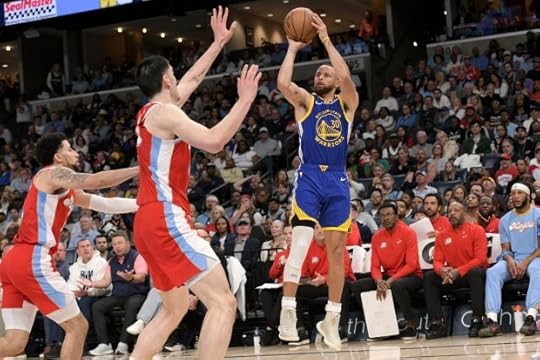 Golden State Warriors guard Stephen Curry (30) shoots against Memphis Grizzlies center Zach Edey, center, and guard Scotty Pippen Jr., left, in the first half of an NBA basketball game, Tuesday, April 1, 2025, in Memphis, Tenn. (AP Photo/Brandon Dill)