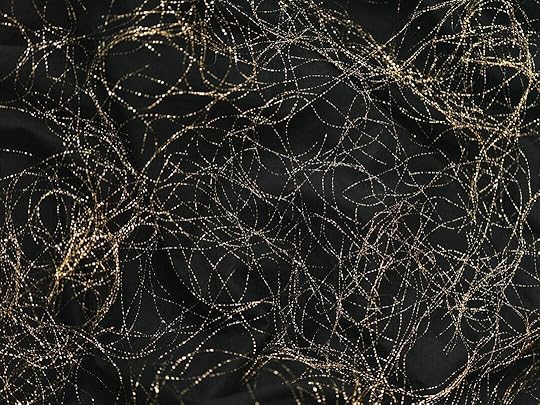 a black background with gold lines and dots