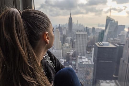 woman looking over the city urban stress