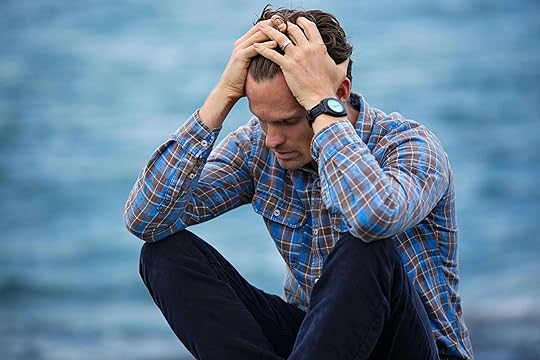 Image of a sad man sitting outside running his hand through his hair. With the support of an adult intensive outpatient program in Houston, TX you can begin to cope with your treatment-resistant depression in healthy ways.