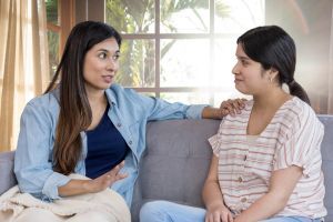 Mom talking to daughter