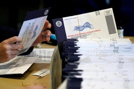 FILE - Chester County, Pa., election workers process mail-in and absentee ballots at West Chester University in West Chester, Pa., Nov. 4, 2020. (AP Photo/Matt Slocum, File)