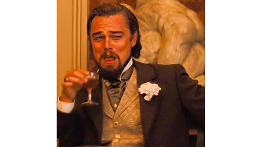Leo DiCaprio in a suit, holding a drink, smiling and looking smug