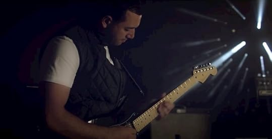 Musician Moez Masoud plays the guitar