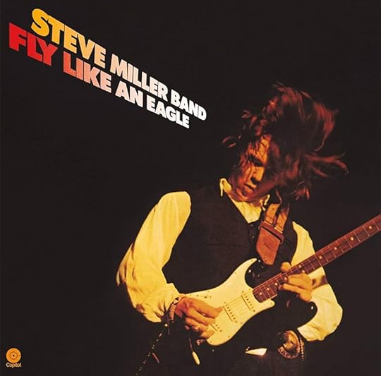 Album cover featuring a photo of a guitarist in mid performance, his long hair flying over his head