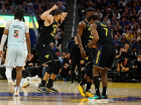 Golden State Warriors’ Stephen Curry (30) celebrates a basket with...