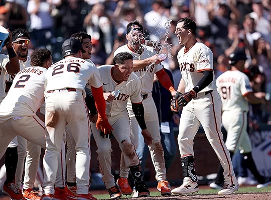 San Francisco Giants’ Mike Yastrzemski #5 is greeted at the...