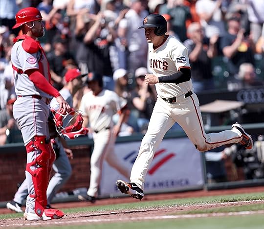 San Francisco Giants’ Wilmer Flores #41 scores past Cincinnati Reds...