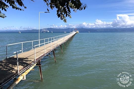 wooden pier over calm ocean water
