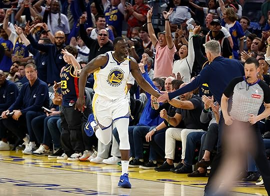 Golden State Warriors’ Draymond Green (23) high-fives Golden State Warriors...