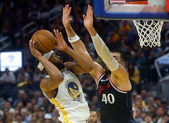 Golden State Warriors’ Moses Moody (4) takes a shot against...