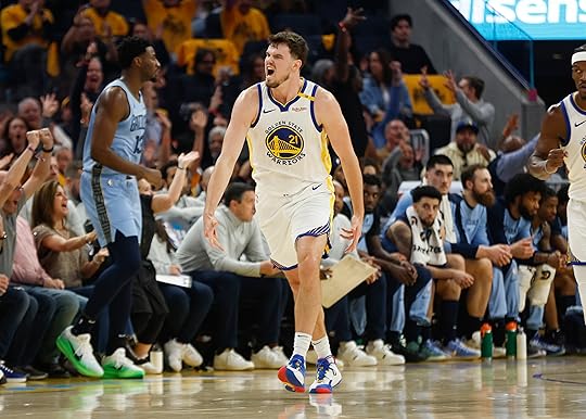 Golden State Warriors’ Quinten Post (21) celebrates his 3-point basket...