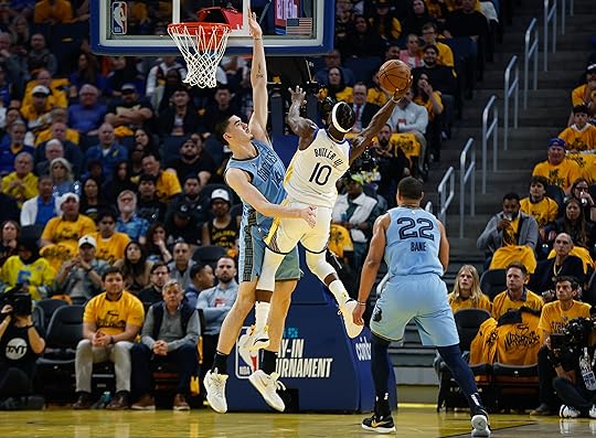 Golden State Warriors’ Jimmy Butler III (10) takes a shot...