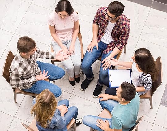 Image of a group of men and women sitting in a circle representing group therapy. With the support of a adult IOP in Houston, TX you can begin to cope and heal from the depression symptoms you struggle with.