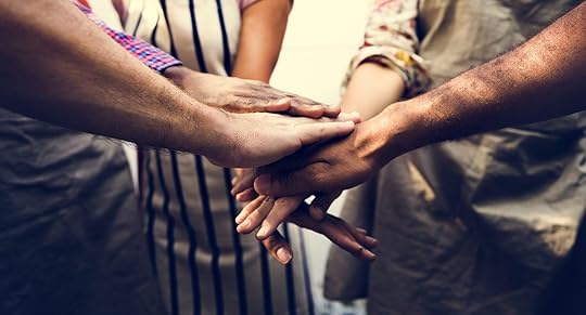 Image of men and women putting their hands on top of each other. Find support battling your anxiety or depression with the help of adult intensive outpatient programs in Houston, TX.