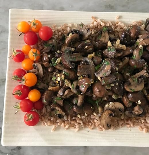 Roasted Mushrooms Gremolata Style are shown served over a bed of farro accompanied by cherry tomatoes. (Photo by Cathy Thomas)