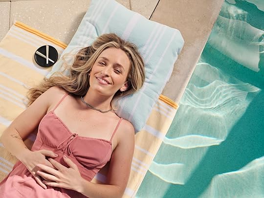 woman laying by pool with cannabis joints