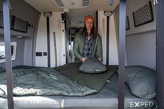 woman with exped luxemat in campervan