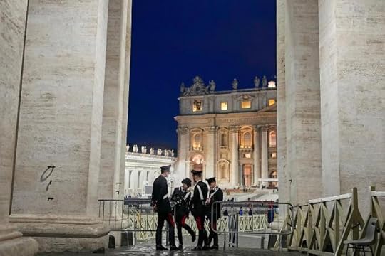 Police officers speak in St. Peter's Square ahead of the funeral of Pope Francis