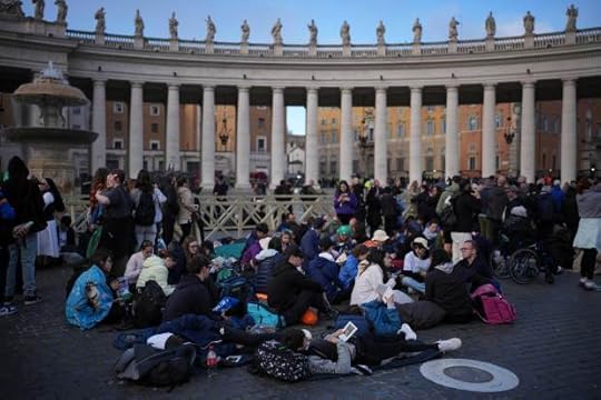 Faithful sit in St. Peter's Square
