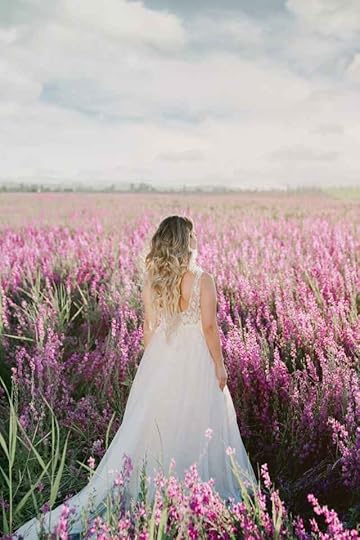 Current image: woman in wedding dress on flower field