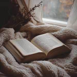 Cozy reading nook with an open book and soft lighting.