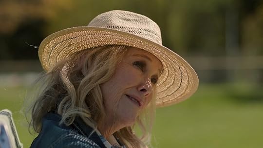Gail in a straw hat outside on a sunny day on The Last of Us
