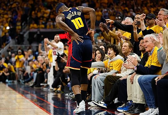 Golden State Warriors’ Jimmy Butler III (10) holds his back...