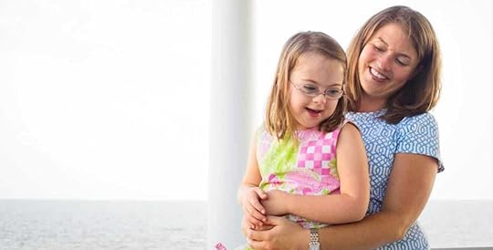 I’m holding Penny on my lap in 2012 as we sit on a porch with the ocean in the background