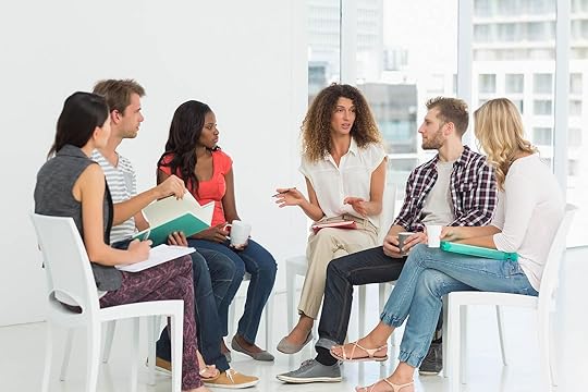 Image of a group of people sitting in a circle in group therapy. In an adult intensive outpatient program in Houston, TX you can learn DBT skills to help you with impulse control and decision-making.