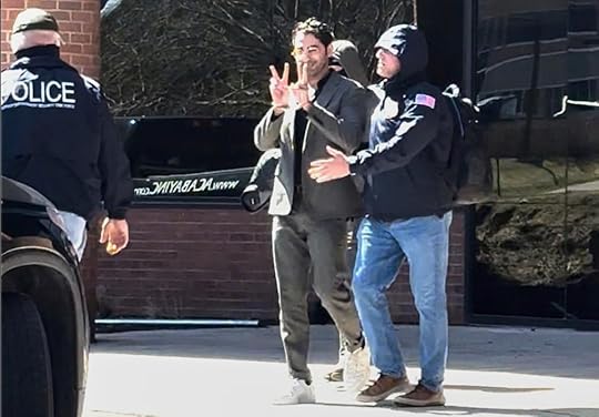 An image taken from a video provided by Christopher Helali shows Mahdawi being detained at a Citizenship and Immigration Services office in Colchester, Vermont, on April 14 (AP)