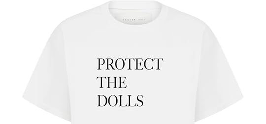 A white t-shirt featuring the bold black text 'PROTECT THE DOLLS' centered on the front.