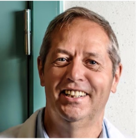 Portrait of Professor Piet Hoebeke, a Belgian urologist, smiling in a medical setting.