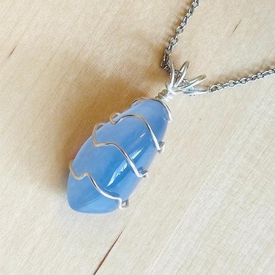 Sky blue chalcedony pendant with silver wire wrap and chain.