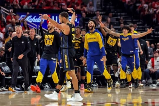 Golden State Warriors players react to Buddy Hield's (7) first quarter buzzer-beater against the Houston Rockets in Game 7 of an NBA basketball first-round playoff series in Houston, Sunday, May 4, 2025. (Carlos Avila Gonzalez/San Francisco Chronicle via AP)