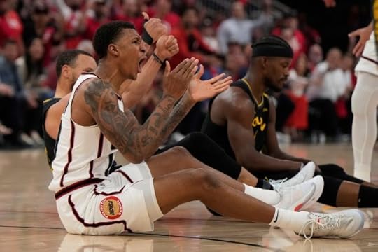 Houston Rockets' Jabari Smith Jr., center, reacts after being fouled by Golden State Warriors' Stephen Curry, back left, during the first half of Game 7 of an NBA basketball first-round playoff series Sunday, May 4, 2025, in Houston. (AP Photo/Ashley Landis)