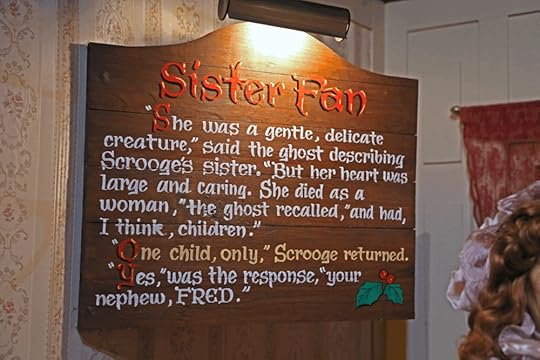 Image: at the downtown Philadelphia Macy's immersive 'A Christmas Carol' installation in 2013, a handpainted sign relates an excerpt of the Dickens story. Under the heading Sister Fan is the text: 