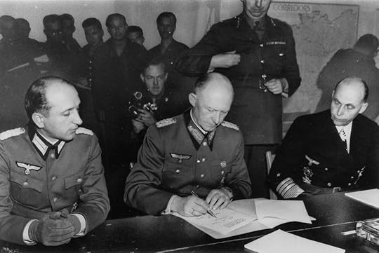 ColGen Alfred Jodl signing the documents of Germany’s surrender, Reims, France, 7 May 1945 (US National Archives: 195337)