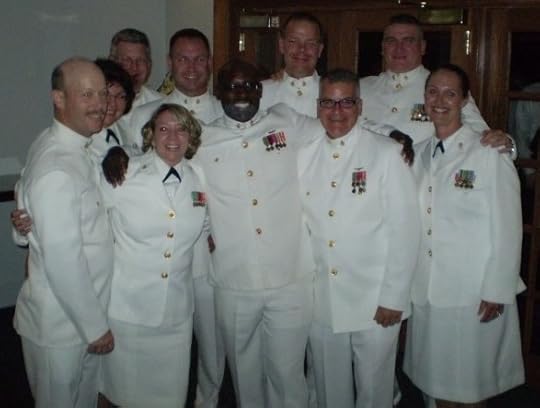 Group of male and female U.S. Navy chief petty officers in choker white uniforms
