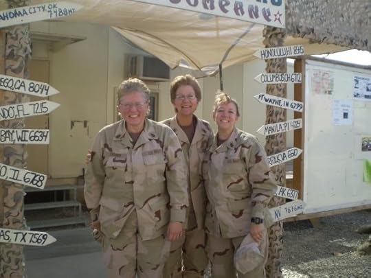 Three female Navy servicemembers standing in between arrows showing distances to various cities