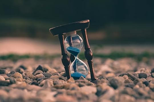 time blocking sand timer on a gravel beach